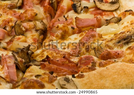 Close up of pizza topping with mushrooms, ham and pineapple