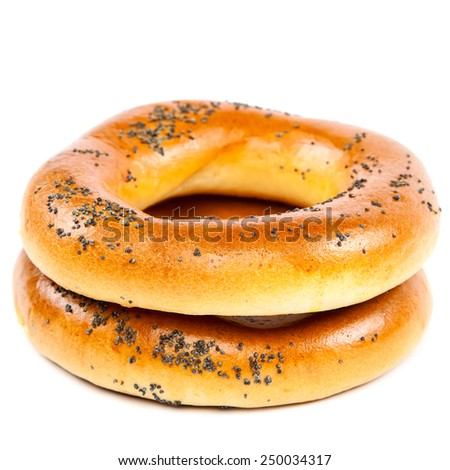 Bagel with poppy seeds isolated on white background.