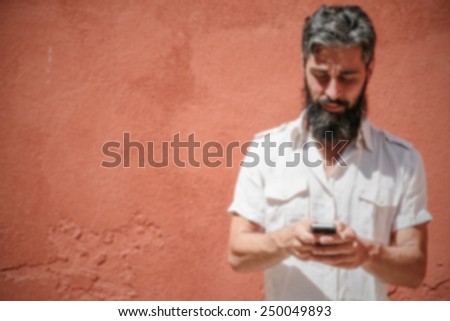 Hipster on the phone. Intentionally blurred editing post production background.