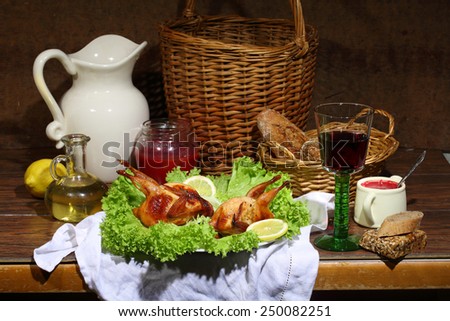 Has sung submitted on leaves of green salad with cowberry sauce, bread and red wine Royalty-Free Stock Photo #250082251