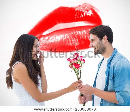 Happy hipster giving his girlfriend roses against white background with vignette