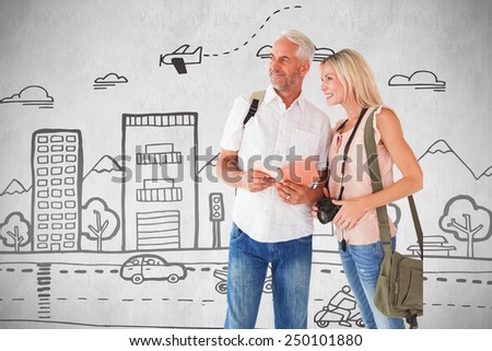 Happy tourist couple using the guidebook against white background