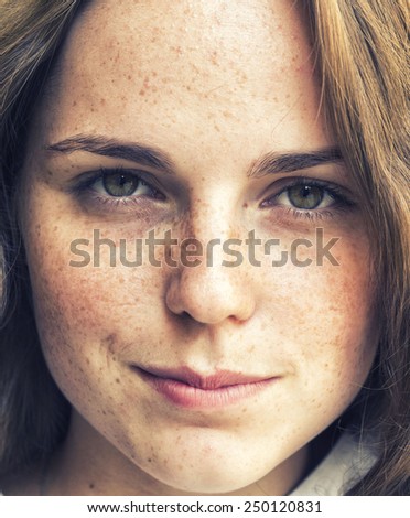 freckled hipster young beautiful woman street outdoor portrait with beautiful eyes 