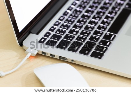 charge battery laptop Royalty-Free Stock Photo #250138786