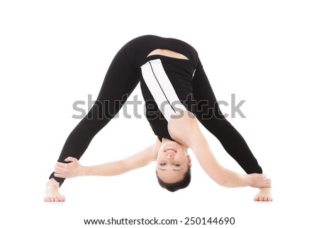 Sporty yoga girl doing fitness training, asana Parivritta Prasarita Padottanasana, Wide stance forward bend pose, isolated on white background