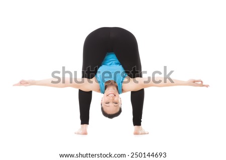 Smiling sporty yogi girl doing fitness exercises, full forward bend, yoga asana Baddha Kundalasana, isolated on white background