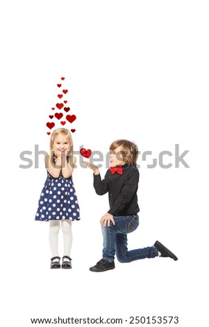 Girl with a rose in her hand standing near the boy on a white background