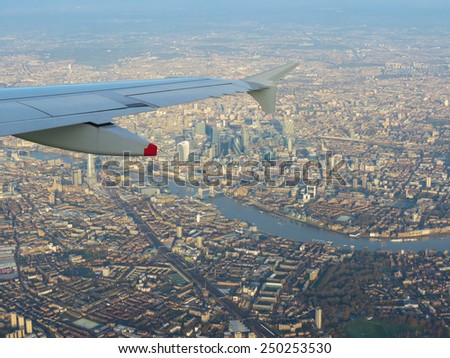 Aerial view from a flying plane in the sky over London city centre