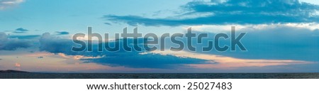 Blue colorful evening sky over sea surface. Eleven shots composite picture.