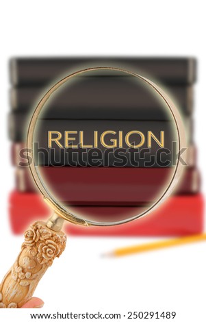 Magnifying glass or loop looking on an educational subject - Religion