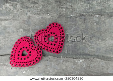 Red hearts on old rustic wooden background