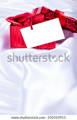 gift box with empty blank for text on a background white silk close up on Valentine's Day