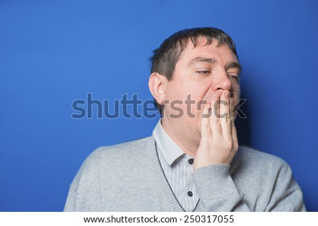 Portrait of a sleepy man yawning