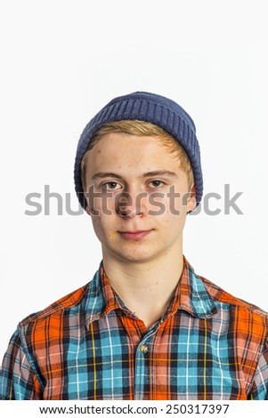 Portrait of a positive boy looking at camera. Isolated over white.