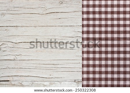 Wooden table covered with tablecloth. View from top texture wallpaper horizontal. Unique perspectives. Empty tablecloth for product montage. Free space for products and for your text