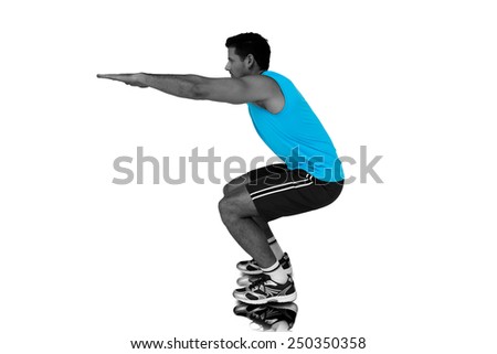Side view of a fit young man doing stretching exercise against mirror