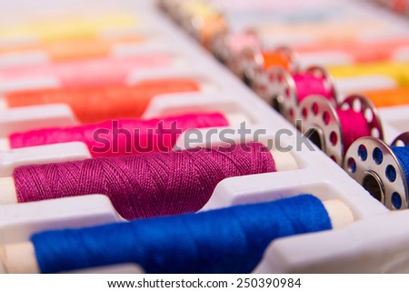 Sewing thread in lots of different colors Royalty-Free Stock Photo #250390984