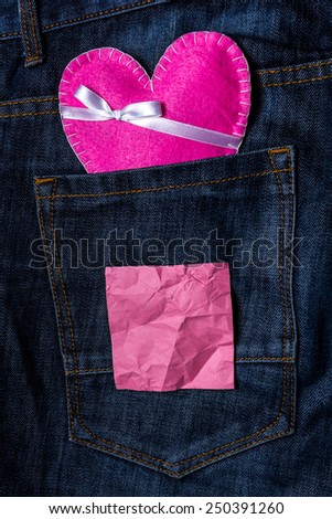 Heart on jeans background with crumpled paper for your text. valentines day card concept 