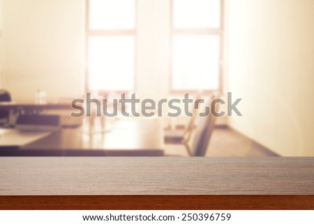 interior of office with window and table with chair and blurry background 