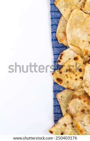 copy space with flat bread on checkered napkin