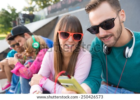 Young couple at the skate park