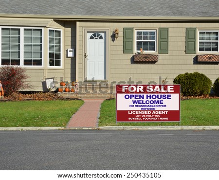 Real estate for sale open house welcome sign closeup view Suburban home landscaped lawn sunny residential neighborhood autumn day USA