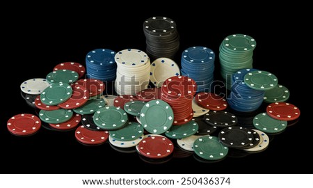 Colorful poker chips on black background
