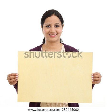 young Happy Indian woman holding billboard