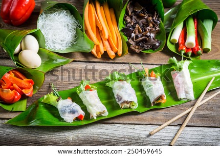 Fresh spring rolls with vegetables and rice noodles Royalty-Free Stock Photo #250459645