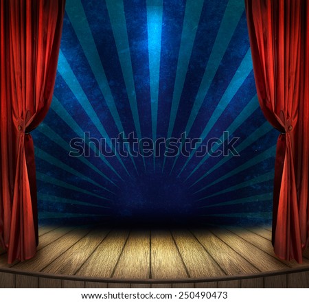 Theater stage with red curtains and spotlights. Theatrical scene in the light of searchlights, the interior of the old theater. Royalty-Free Stock Photo #250490473