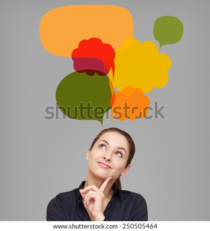 Happy business woman looking on many bright colorful bubbles. Creative chart design on grey background