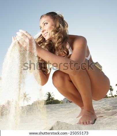Woman playing with sand