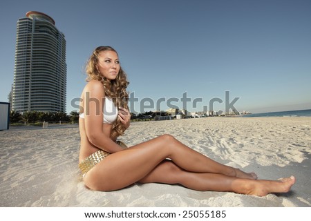 Beautiful woman sunbathing on the sand