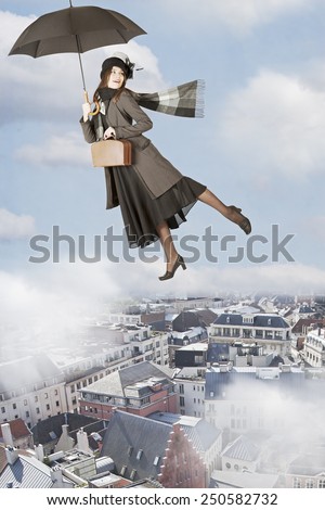 Mary Poppins flies on an umbrella over the city   Royalty-Free Stock Photo #250582732