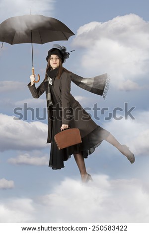 Picture with Mary Poppins flies on an umbrella   Royalty-Free Stock Photo #250583422