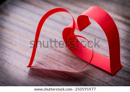 two beautiful romantic paper tape in the shape of heart on a vintage wooden background - pictures concept theme Love and St. Valentine's Day