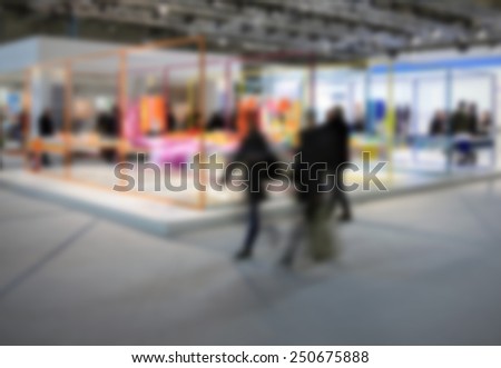 People visiting a trade show. Intentionally blurred editing post production.
