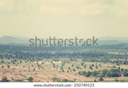 Landscape with fields and mountains