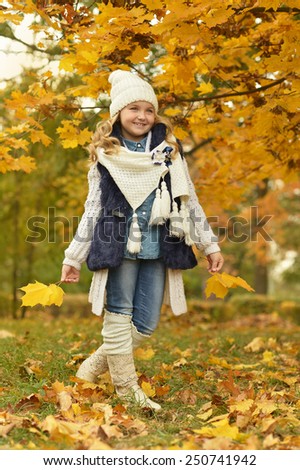 Beautiful cute girl in white boots on a daily walk in the park