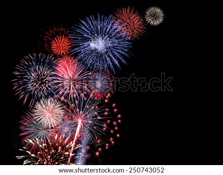 Huge colorful fireworks display Royalty-Free Stock Photo #250743052