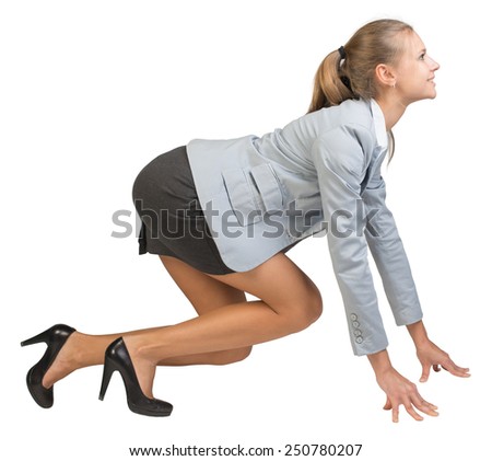 Businesswoman standing in running start pose, smiling, side view. Isolated over white background