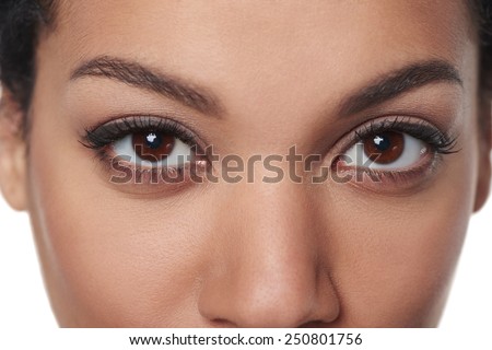 Cropped closeup image of breathtaking female brown eyes staring at you Royalty-Free Stock Photo #250801756