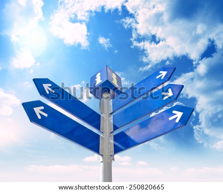 Blank signpost with  arrows over blue sky - just add your text