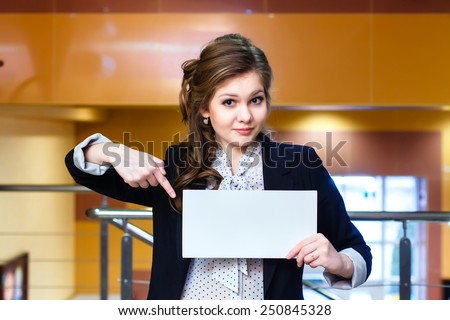 young beautiful girl shows on blank white card