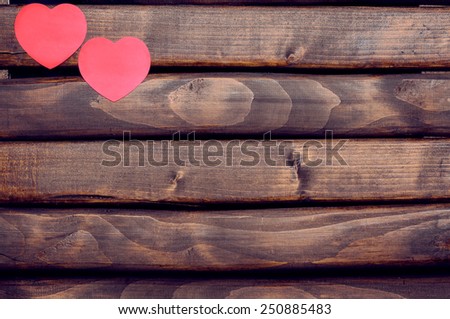 Red heart stickers on a dark wooden background.Background Valentines Day.Valentine's Day.Valentines Day.Valentines day ideas.Valentines day cards.International women's day.Women's day.March 8.