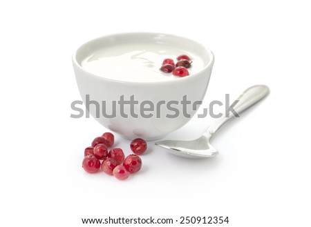Yogurt in a bowl with cranberries and spoon isolated on white background Royalty-Free Stock Photo #250912354