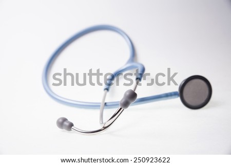 A blue stethoscope on a white background