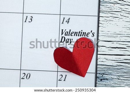 February 14, on the calendar, Valentine's day, heart from red paper