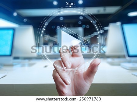 hand press play button sign to start or initiate projects as concept  Royalty-Free Stock Photo #250971760