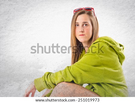 Young blonde girl over textured background